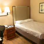 single queen bed guest room