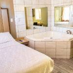 whirlpool tub suite with one guest bed