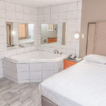 whirlpool tub suite with one guest bed